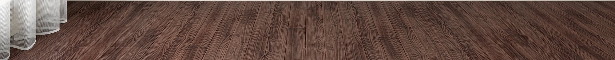 Up-close photo of wood flooring with curtain hanging on floors